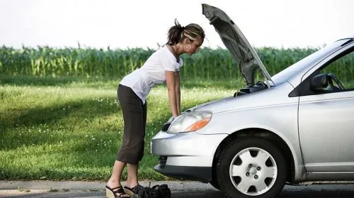 Lady with a broken down car